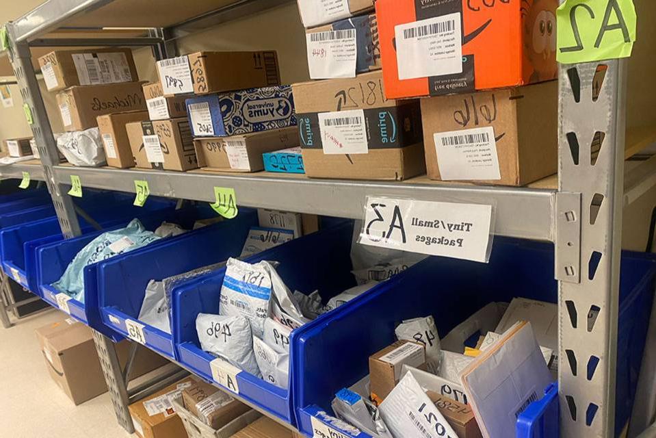 Shelves of packages in the 博彩网址大全 Mailroom